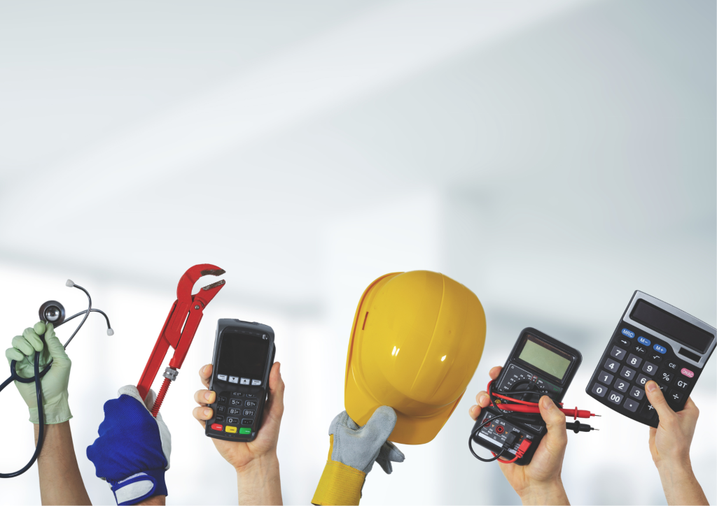 Raised hands holding tools from different jobs, including a stethoscope, wrench, card reader, hard hat and calculator